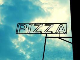 Pizza sign over sky photo