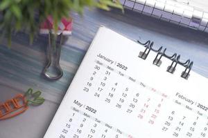 2022 January month on calendar on office desk photo