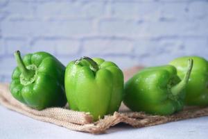 Yellow orange and red capsicum on white background photo