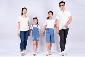 Portrait of Asian family on white background photo