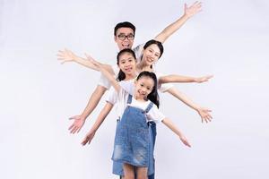 Portrait of Asian family on white background photo