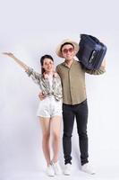 Young Asian couple posing on white background photo