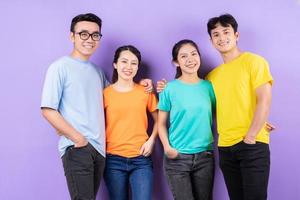 Asian best friends posing on purple background photo