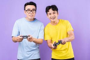 Two Asian brothers playing games together photo