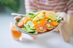 Young Asian woman with healthy meals photo