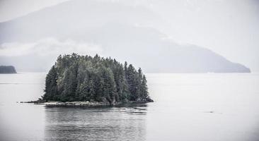 Alaska nature and mountain range with seascape in june photo