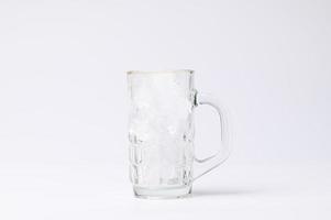 glass with ice on a white background photo