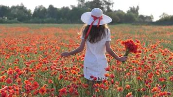 Young brunette woman in white dress stands in the middle of the field video