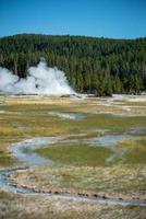 Eruption of Old Faithful geyser at Yellowstone National park photo