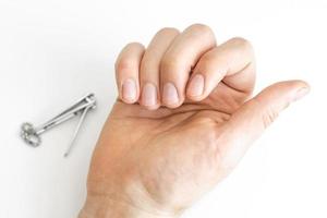 Trimmed nails of a young man photo