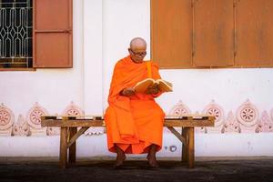 Monks in Thailand are reading books photo