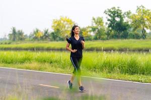 Sports girl, Woman running on road, Healthy fitness woman training photo