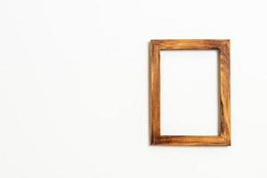 Empty picture frame on white wall background with copy space photo