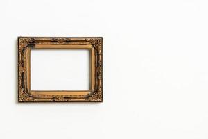 Empty picture frame on white wall background with copy space photo