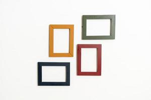 Empty picture frame on white wall background with copy space photo