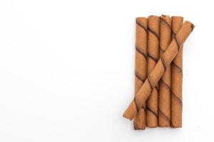 Chocolate wafer stick roll isolated on white background photo