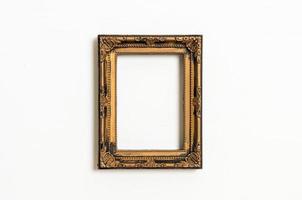 Empty picture frame on white wall background with copy space photo