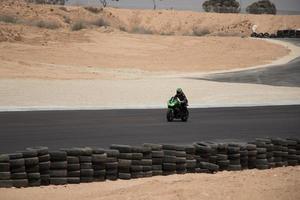 City, Country, MMM DD, YYYY - Motorcycle competition at a race track photo