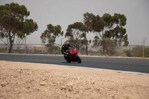 City, Country, MMM DD, YYYY - Motorcycle competition at a race track photo