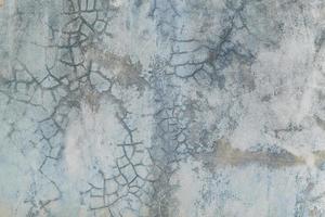 Grunge bare cracked concrete wall texture background. photo