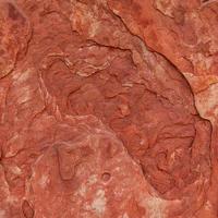 Red rough stone texture background. photo