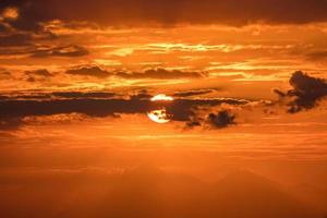 Beautiful golden orange sunset over the ocean. photo