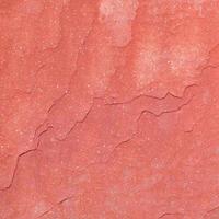 Red rough stone texture background. photo