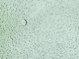 Rain drop on glass surface. photo