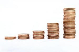 Coin piles on white background. photo