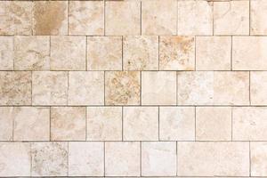 White tiles stone wall texture.