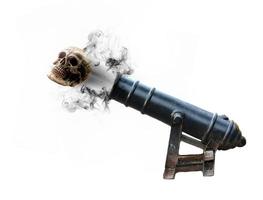 Old cannon shooting skull, death concept