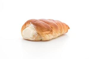 Bread roll with cream on white background photo