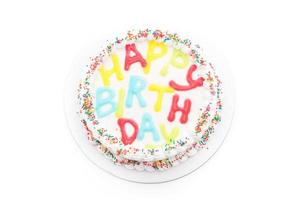 tarta de cumpleaños feliz sobre fondo blanco foto