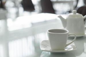 Hot tea cup on the table photo