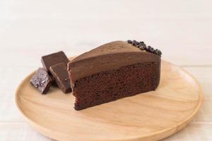 Chocolate cake on wood plate