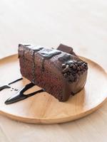 Chocolate cake on wood plate photo