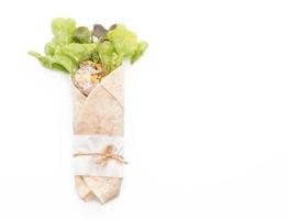 Wrap salad roll with tuna corn salad on white background photo