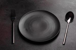 Set of tableware ready for the meal with black copy space
