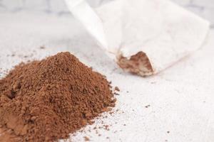 coco powder in a bowl on table, photo