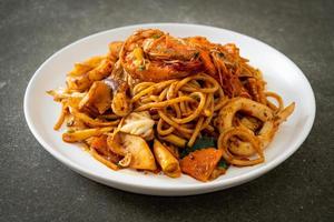 Stir-fried Tom Yum seafood dried spaghetti - Fusion food style photo