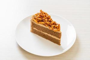 Homemade coffee almonds cake on white plate photo