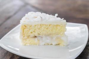 Coconut cake on white plate photo