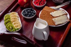 Delicious breakfast with fresh croissants and ripe berries photo