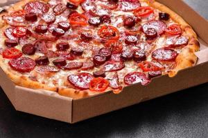 Pepperoni Pizza with Mozzarella cheese, salami and ham photo