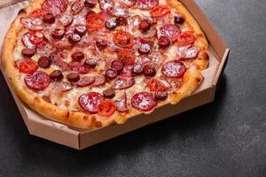 Pepperoni Pizza with Mozzarella cheese, salami and ham photo