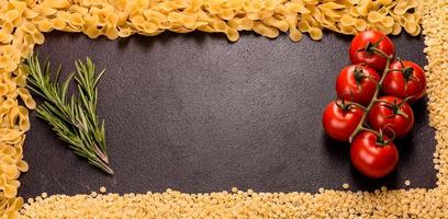 Ingredients for cooking paste on a dark background photo