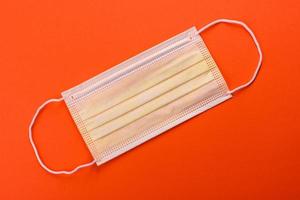 Medical mask on a colored background photo