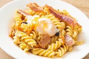 Carbonara fusilli pasta spicy bacon - Italian food style photo