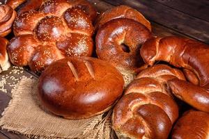 Composition of fresh baked sweet buns with poppy and jam photo