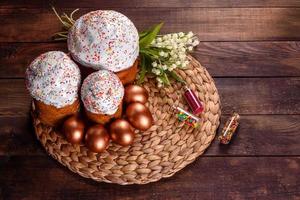 Easter eggs gold and bronze and Easter cake photo